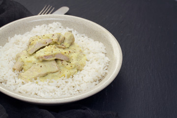 turkey curry with boiled rice on plate