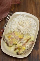 boiled fish with boiled rice and sauce on plate