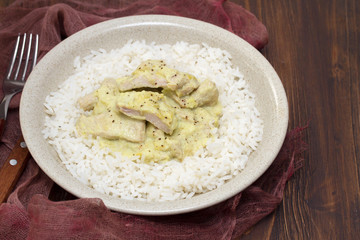 turkey curry with boiled rice on plate