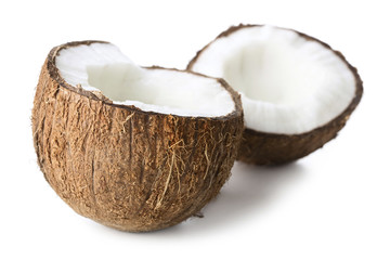 two halves of coconut isolated on white background