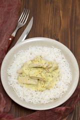 turkey curry with boiled rice on plate