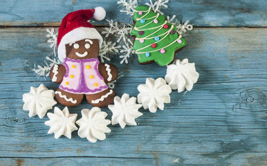 Christmas homemade gingerbread couples on wooden table