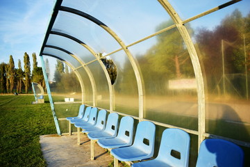 Bench of a football field in a little town in Italy. 