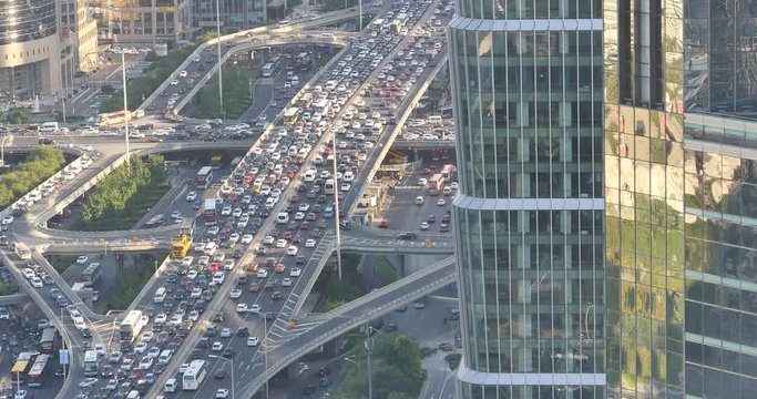 4k,Aerial View of heavy traffic through BeiJing central business district that is located in the Chaoyang district,It's the main hub for financial and business activities in China's capital city.