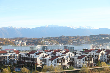 Beautiful view of the mountains. In the foreground, cottages and buildings