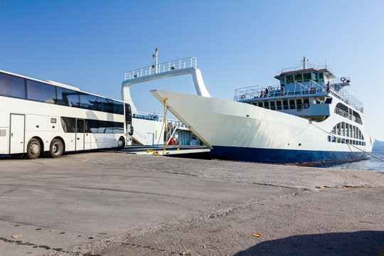 Vehicle, bus is entering to ferryboat's deck, boarding cargo