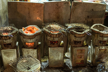 Barbecue in the streets of Bangkok, the best place for street food in the world. Gridiron with fish and lobster over charcoal grill © ksl