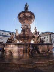 Fototapeta na wymiar The Neptune fountain in Cathedral Square, Trento, Italy.