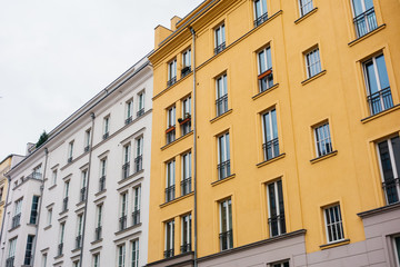 white and yellow apartment buildings in a street at germany