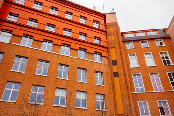 Bright orange facade of an old industrial building