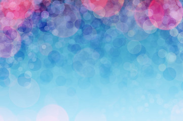 Abstract sparkles or glitter lights. Festive blue background. Christmas background