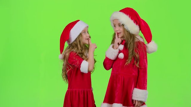 Baby of the assistant Santa Claus say quietly to their elves. Green screen. Slow motion