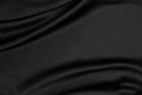 Fototapeta Black fabric texture background. Smooth elegant black silk can use as wedding background.