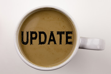 Update Writing text in coffee in cup. Business concept for Digital Internet Improvement on white background with copy space. Black text
