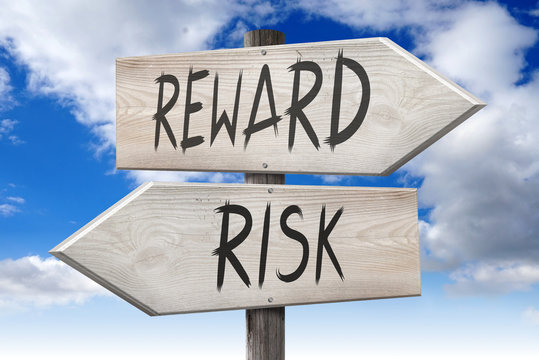 Risk, reward - wooden signpost