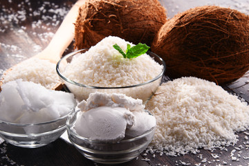 Composition with bowl of shredded coconut and shells