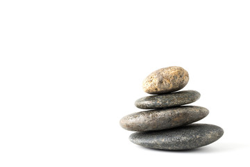 Stack of stones balancing isolated on white background