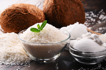 Composition with bowl of shredded coconut and shells