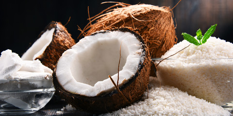 Composition with bowl of shredded coconut and shells