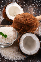 Composition with bowl of shredded coconut and shells