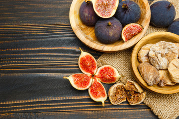 Fresh and dried Fig isolated on wooden background