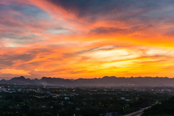 Fototapeta premium Landscape view of sunset with coutnryside town