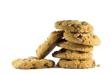 Isolated chocolate chip cookies. Seven delicious cookies isolated on white background with a clipping path. Close up side view.