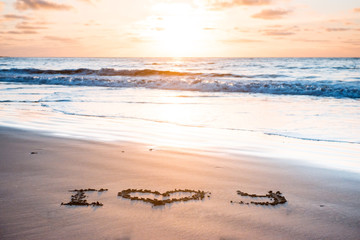 I love you on sand beach