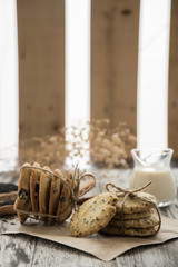 cookies with sesame seeds and glass of milk