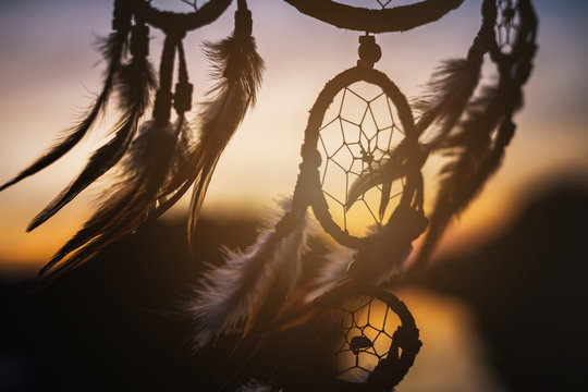 Dream catcher in the wind with beautiful sunset