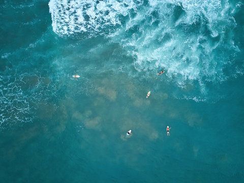 Surfers catching big wave