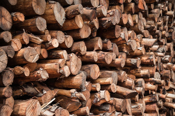 Natural wooden background - closeup of chopped firewood.