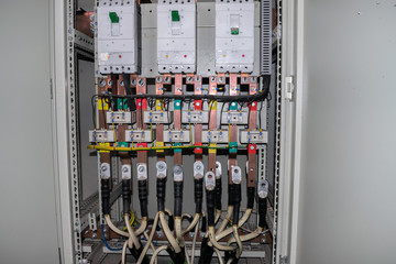 Electrical panel containing a lot of wires, switches, contacts