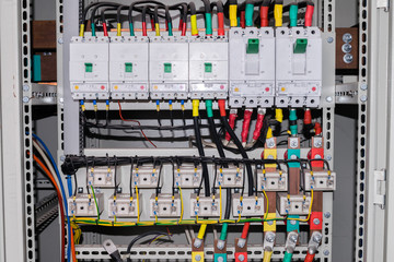 An electrical box containing a multitude of wires, switches, contacts