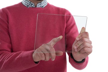 Mid section of man holding glass digital tablet