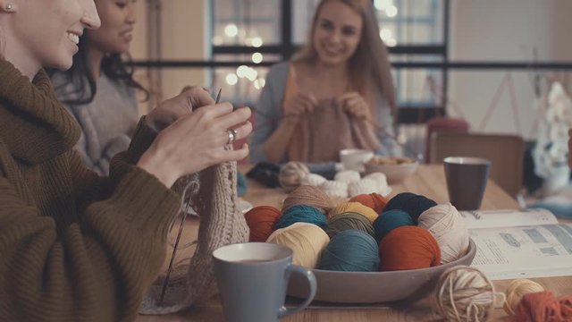 Young girls learning knitting