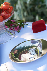 Outdoor  ceremony wedding rings on silver plate