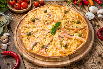 Italian pizza with cheese, on a wooden table