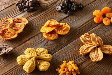 Dried fruits on wooden background