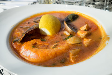 Maltese tomato seafood soup with giant shrimps, clams, mussels, fish and calamari