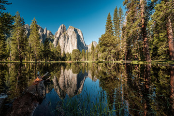 Middle Cathedral Rock reflecting in Merced River at Yosemite