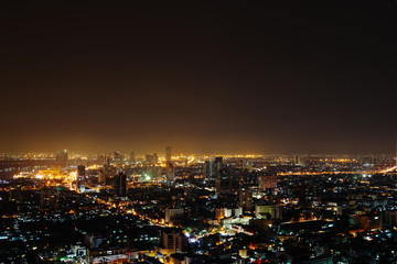 Bokeh of megapolis at night with light of city. brown colors. Bangkok, asia, Background, copy space. summer