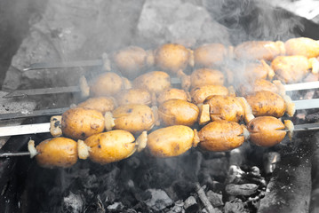 Black and white, colorful photos. Potatoes on the fire.