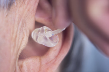Naklejka premium Hearing aid in ear