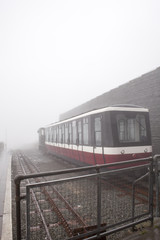 Retro steam train departs from the railway station in the UK snowdon