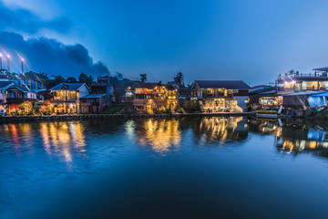 Fototapeta na wymiar scenery view. beautiful waterfront village in night scene have light from house