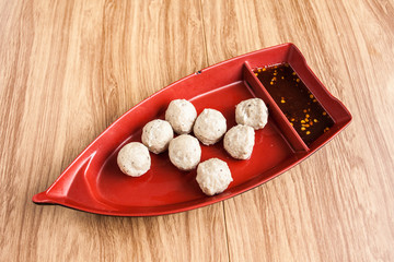 pork meatball in the boat bowl and sauce chilli