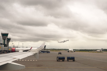 Fototapeta na wymiar View of airport on airplane taking off