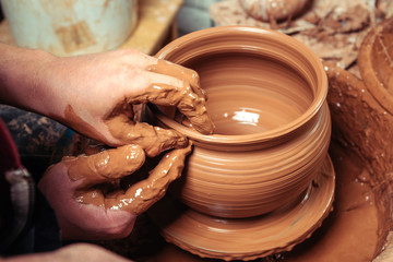 Potter at work. Workshop place.