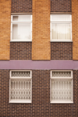 Old red brick wall with windows in Wolverhampton